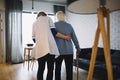 A person standing in a room. Woman walking with nurse old age home Royalty Free Stock Photo