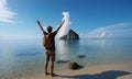 Silhouette of a man with raised hands against the sea Royalty Free Stock Photo