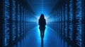 person stands in glowing data center corridor, surrounded by servers Royalty Free Stock Photo