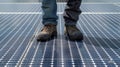 A person stands on a nonslip mat while cleaning a solar panel preventing slips and falls that could result in injury or