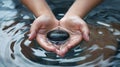 Person Holding Rock in Water Royalty Free Stock Photo