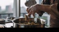 A person stirring food in a pot on a stove. Generative AI image.
