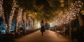 Person strolling along a peaceful city promenade, lined with trees adorned in twinkling fairy lights for a magical