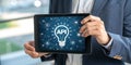Person holding tablet displaying api concept with lightbulb and network connections Royalty Free Stock Photo
