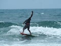 Person surfing in the sea captured during the daytime