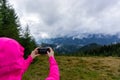 Person takes picture in the mountains. Royalty Free Stock Photo