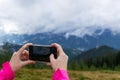 Person takes picture in the mountains. Royalty Free Stock Photo