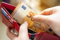 Person taking out euro money from her pocket wallet. Man counting money, economy concept, money distribution Royalty Free Stock Photo