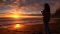 person taking photo of sea with smartphone at sunset over beach, silhouette of woman photographing nature at vacation Royalty Free Stock Photo