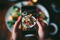 Person taking photo tasty food. Generate Ai