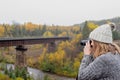 Woman taking photo of bridge over river in Ontario Canada Royalty Free Stock Photo