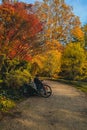 Person taking rest on the park bench after cycling.