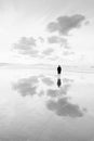 Person thinking in the beach looking at sea