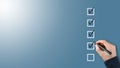 person ticking checkboxes with marker pen on checklist or to-do-list