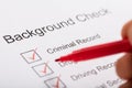 Person Ticking Off Checkboxes In Background Check Form