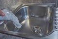 Stop motion of person tipping glass with plastic into the sink. Micro plastic stop motion. Water contamination with microplastics