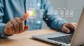 Person touching digital document checklist on screen with laptop interface Royalty Free Stock Photo