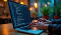 Person types code on laptop. Close-up shot of hands on laptop keyboard. Programming concept. Web designer working on project.