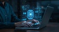 A person types on a laptop with a digital overlay displaying various futuristic