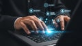 Businessman typing on laptop keyboard with a glow, symbolizing digital data security and document management. Royalty Free Stock Photo