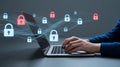 Person typing on laptop with digital security locks and data streams cybersecurity protection Royalty Free Stock Photo