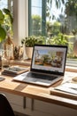 A person typing away at their desk while looking out the window