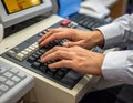 Person Typing on Computer Keyboard in Office Environment Royalty Free Stock Photo