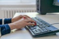 person typing on keyboard in ofice Royalty Free Stock Photo