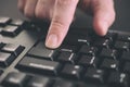 Person typing on a keyboard and pressing Enter key Royalty Free Stock Photo