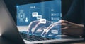 Person typing on laptop with chat ai interface overlayed on screen and hands visible in foreground Royalty Free Stock Photo