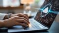 Person typing on laptop with cloud computing and data icons Royalty Free Stock Photo
