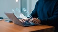 Person typing on laptop with cloud computing icons and digital services Royalty Free Stock Photo