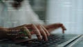 Person Typing on Laptop with Code Overlay, Focused on Programming Language Syntax and Digital Technology in Modern Royalty Free Stock Photo