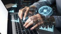 A person typing on a laptop with a futuristic digital interface Royalty Free Stock Photo