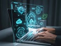 Person typing on laptop with futuristic digital interface displaying various data icons and graphics Royalty Free Stock Photo