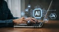 A person is typing on a laptop, highlighting the theme of artificial intelligence (AI). Royalty Free Stock Photo