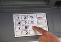 Person typing the secret code into the ATM machine Royalty Free Stock Photo