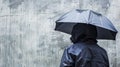Person With Umbrella Standing in Front of Wall Royalty Free Stock Photo