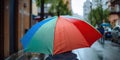 Person Under An Colorful Umbrella In The Rain