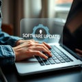 Person updating software on a laptop computer with digital interface Royalty Free Stock Photo