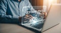 A person updating software on a laptop with a virtual software update interface displayed above Royalty Free Stock Photo