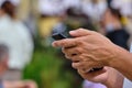 Person uses smartphone in the city in summer