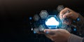 A person uses a smartphone with virtual cloud icons and data technology elements, representing mobile cloud computing, digital Royalty Free Stock Photo