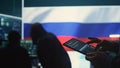 Person uses tablet in governmental cyber security room working for Russian flag