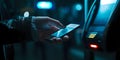 Person using ATM at night, illuminated keypad, secure banking. urban financial transaction, modern lifestyle. easy bank Royalty Free Stock Photo