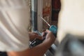 Person using a battery powered drill to install modern pvc windo