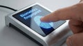 Person using a biometric fingerprint scanner for security authentication and identification Royalty Free Stock Photo
