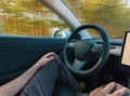 Person using a car in autopilot mode Royalty Free Stock Photo
