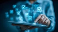 Person using a digital tablet with glowing checkmark icons representing completed tasks and successful validation in a modern Royalty Free Stock Photo