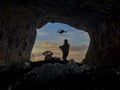 person using drone in mysterious cave